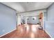 Open living space with hardwood floors, a fireplace, and an open staircase at 1796 S Yampa Way, Aurora, CO 80017