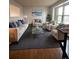 Bright living room featuring hardwood floors, a large window, and comfortable seating for relaxation at 1796 S Yampa Way, Aurora, CO 80017