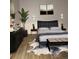 Stylish main bedroom featuring modern decor, a comfortable bed, and elegant furnishings at 1796 S Yampa Way, Aurora, CO 80017