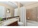 Well-lit bathroom with a granite countertop, tiled backsplash, and shower-tub combination at 9290 Melborne Ct, Parker, CO 80134
