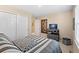 Comfortable bedroom featuring neutral decor and a stylish media console for added convenience at 9290 Melborne Ct, Parker, CO 80134