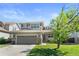 Beautiful two-story home with a well-manicured lawn, lovely landscaping and attached two car garage at 9290 Melborne Ct, Parker, CO 80134