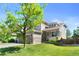 Charming two-story home with a well-manicured lawn, flower beds and attached two-car garage at 9290 Melborne Ct, Parker, CO 80134