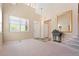 Inviting foyer with high ceilings, neutral colors, and abundant natural light creates a welcoming entry at 9290 Melborne Ct, Parker, CO 80134