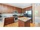Bright kitchen featuring granite countertops, stainless steel appliances, and a center island at 9290 Melborne Ct, Parker, CO 80134