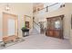 Bright living room featuring a staircase, hardwood floors, and a large mirror at 9290 Melborne Ct, Parker, CO 80134