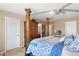 Bedroom featuring a canopy bed, closet and bathroom access at 9290 Melborne Ct, Parker, CO 80134