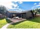Backyard featuring a patio area, lush lawn, and modern exterior design at 2140 Tabor Dr, Lakewood, CO 80215