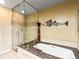 Bathroom featuring a glass shower door and a soaking tub with granite surround at 400 E 3Rd Ave # 305, Denver, CO 80203