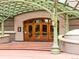 Elegant building entrance with decorative archway and inviting wooden doors at 400 E 3Rd Ave # 305, Denver, CO 80203
