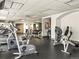 A well-equipped gym featuring cardio machines, weightlifting stations, and mirrored walls for fitness enthusiasts at 400 E 3Rd Ave # 305, Denver, CO 80203