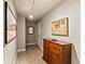 Hallway featuring tiled floors, neutral walls, and art displays at 400 E 3Rd Ave # 305, Denver, CO 80203