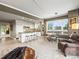This open-concept living space features a kitchen, dining area, and seating for Gathering and friends at 400 E 3Rd Ave # 305, Denver, CO 80203