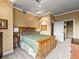 Well-lit bedroom featuring carpet flooring, neutral walls, and an ensuite bathroom at 400 E 3Rd Ave # 305, Denver, CO 80203