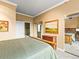 Bedroom featuring carpet flooring, neutral walls, closet, and an ensuite bathroom at 400 E 3Rd Ave # 305, Denver, CO 80203