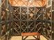 Spacious wine cellar with custom-built metal racks and wooden bench, perfect for wine enthusiasts at 400 E 3Rd Ave # 305, Denver, CO 80203