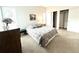 Spacious bedroom with neutral carpet, closet and a large window providing ample natural light at 4493 Dunkirk Way, Denver, CO 80249