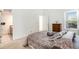 Comfortable bedroom with a bed, neutral walls, and bright natural light at 4493 Dunkirk Way, Denver, CO 80249