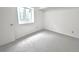 Finished bedroom with carpet, window and neutral walls and trim at 4493 Dunkirk Way, Denver, CO 80249