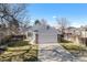 Charming exterior with attached garage and well-maintained lawn and driveway at 4493 Dunkirk Way, Denver, CO 80249