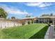Lush green backyard with a manicured lawn and wood privacy fence, perfect for outdoor living at 7891 Poplar St, Commerce City, CO 80022