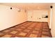 Spacious basement offering built-in shelving and tile floors at 7891 Poplar St, Commerce City, CO 80022