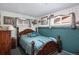 Cozy bedroom with fishing themed decorations and wood furnishings at 7891 Poplar St, Commerce City, CO 80022