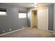 Bedroom featuring neutral walls, carpet floors, two windows, and closet at 7891 Poplar St, Commerce City, CO 80022