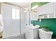 Bathroom with a shower/tub combo, modern vanity, and ample storage at 3080 S Eudora St, Denver, CO 80222