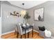 Charming dining area featuring modern lighting and seating for four at 3080 S Eudora St, Denver, CO 80222