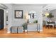 Inviting entryway boasts hardwood floors, stylish decor, and access to dining room at 3080 S Eudora St, Denver, CO 80222