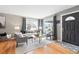 Bright living room with hardwood floors, stylish furnishings, and plenty of natural light at 3080 S Eudora St, Denver, CO 80222