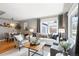 Stylish living room and dining area with hardwood floors, comfortable seating, and natural light at 3080 S Eudora St, Denver, CO 80222