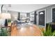 Bright living room with hardwood floors, neutral decor, and large windows at 3080 S Eudora St, Denver, CO 80222