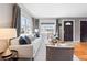 Cozy living room featuring hardwood floors, comfortable seating, and natural light from large windows at 3080 S Eudora St, Denver, CO 80222