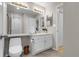 Bathroom featuring toilet, vanity with a single sink and a large mirror at 7291 E Bentley Cir, Centennial, CO 80122