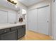 Neutral bathroom features a gray vanity with double sinks, and a large closet at 7291 E Bentley Cir, Centennial, CO 80122