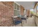 Relaxing front porch with seating area, perfect for enjoying the outdoors at 7291 E Bentley Cir, Centennial, CO 80122