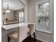 Cozy breakfast nook with two chairs and a large window letting in natural light, adjacent to the dining area at 7291 E Bentley Cir, Centennial, CO 80122