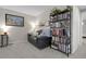 Comfortable seating area in living room featuring carpet, decor, and artwork at 7291 E Bentley Cir, Centennial, CO 80122