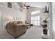 Bright and airy living room with vaulted ceilings and a cozy fireplace at 7291 E Bentley Cir, Centennial, CO 80122
