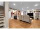Inviting living room with hardwood floors and sports-themed decorations displayed throughout at 7291 E Bentley Cir, Centennial, CO 80122