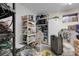 Unfinished storage room with shelving, providing ample space for organization and storage at 7291 E Bentley Cir, Centennial, CO 80122