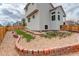 Fenced backyard with a patio area and landscaped retaining walls at 8510 Bluegrass Cir, Parker, CO 80134