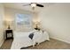 Inviting bedroom with a well-lit nightstand and large window with neighborhood views at 8510 Bluegrass Cir, Parker, CO 80134