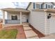 Close up of a house showcasing the front porch and entryway with mulched flowerbeds at 8510 Bluegrass Cir, Parker, CO 80134