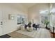 A bright living room enhanced by large windows, a decorative rug, and modern decor at 8510 Bluegrass Cir, Parker, CO 80134