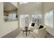 Bright living room with carpet and large windows, complemented by modern furnishings and decor at 8510 Bluegrass Cir, Parker, CO 80134