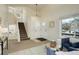 Cozy living room featuring carpet, staircase to the upper level, and lots of natural light at 8510 Bluegrass Cir, Parker, CO 80134