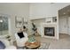 Cozy living room features a fireplace, modern decor, and a comfortable seating area at 8510 Bluegrass Cir, Parker, CO 80134